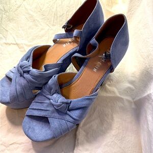 Women’s blue suede platform heels.